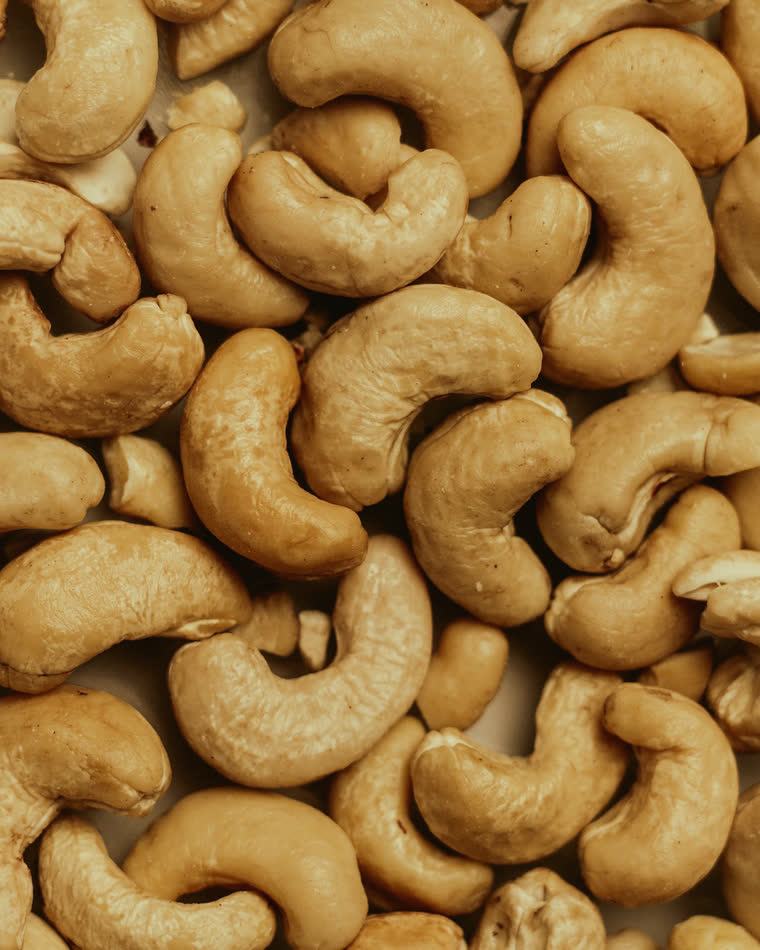 A heap of cashew nuts, close up.
