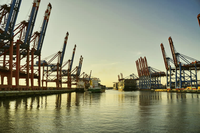 Quay cranes at the port, in evening light.
